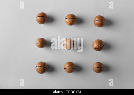Tasty macadamia nuts on light background Stock Photo