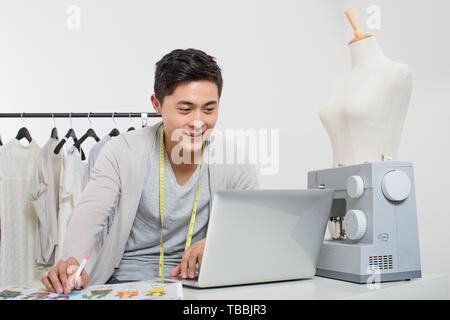 Costume designer designs costumes Stock Photo