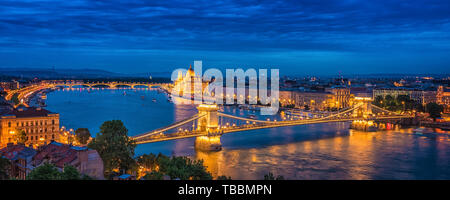 Panorama of Budapest at night. Hungarian landmarks: Chain Bridge, Parliament and Danube river in Budapest. Stock Photo