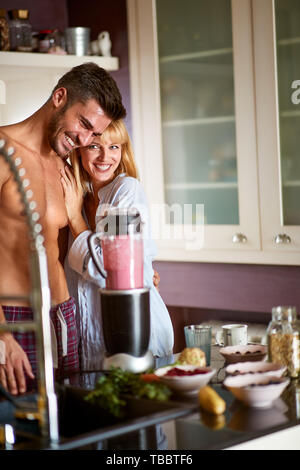 Couple in love in the kitchen together Stock Photo