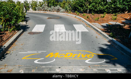 Cascais, Portugal - May 31, 2019: Entrance to an empty McDrive drive-thru at a McDonald's fast-food restaurant Stock Photo