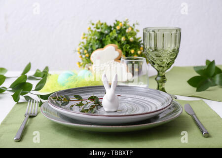 Beautiful Easter table setting with floral decor Stock Photo
