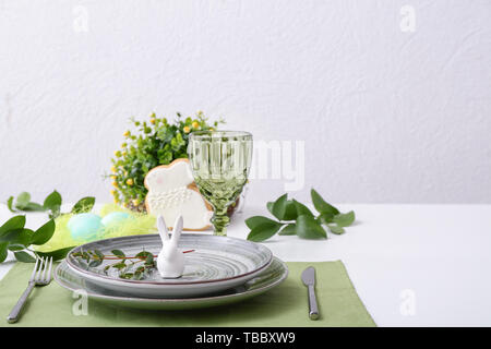 Beautiful Easter table setting with floral decor Stock Photo