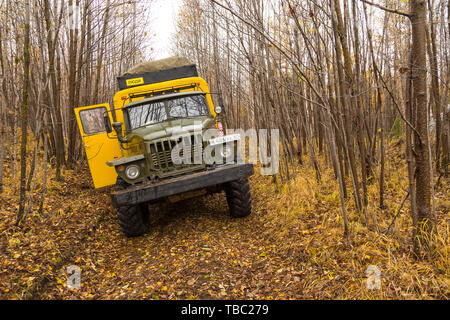 Kamczatka Peninsula, Russia- 30 September 2014: Russian off-road extreme expedition truck with passengers. Duct in the forest into deep Kamchatka. Stock Photo