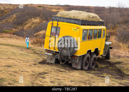 Kamczatka Peninsula, Russia- 30 September 2014: Russian off-road extreme expedition truck with passengers. Duct in the forest into deep Kamchatka. Stock Photo