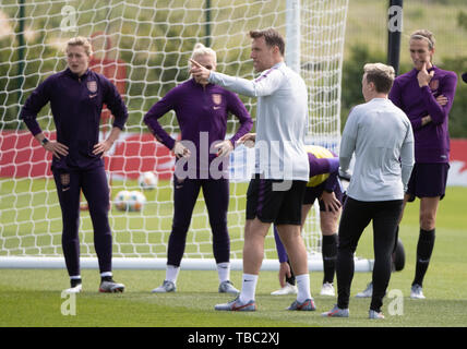 England manager Phil Neville speaks to the team during a training session at The American Express Elite football Performance Centre, Brighton. Stock Photo