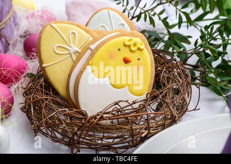 Tasty Easter cookies on table Stock Photo