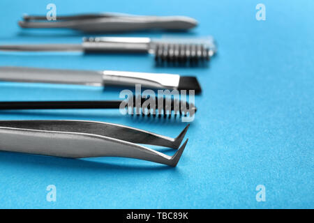 Set of tools for eyebrows correction on color background Stock Photo