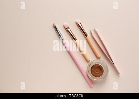 Set of tools for eyebrows correction on light background Stock Photo