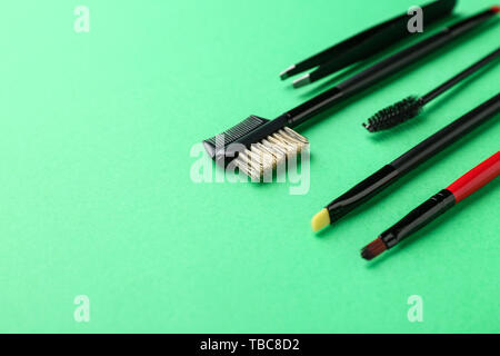 Set of tools for eyebrows correction on color background Stock Photo