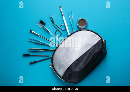 Set of tools for eyebrows correction on color background Stock Photo