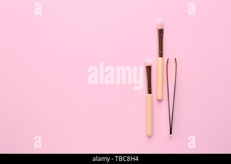 Set of tools for eyebrows correction on color background Stock Photo