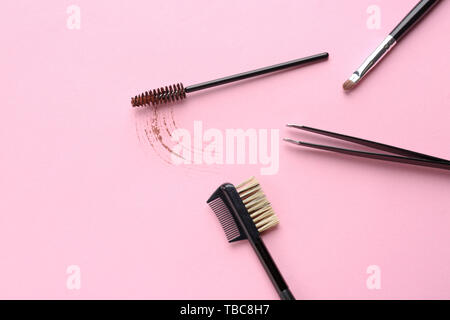 Set of tools for eyebrows correction on color background Stock Photo