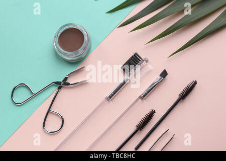Set of tools for eyebrows correction on color background Stock Photo