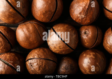 Tasty macadamia nuts as background Stock Photo
