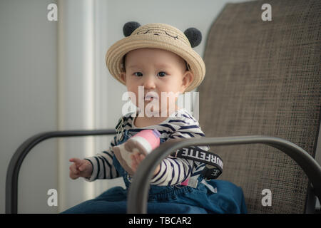 Nine-month-old toddler takes photo on cruise ship trip Stock Photo