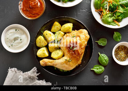 Fried chicken leg with potato. Dish for dinner. Top view, flat lay Stock Photo
