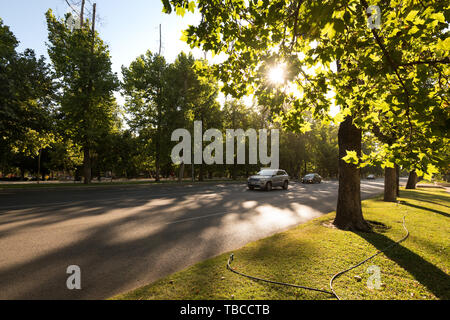 Santiago, Region Metropolitana, Chile - Traffic in the Forestal Park at downtown with a setting sun. Stock Photo