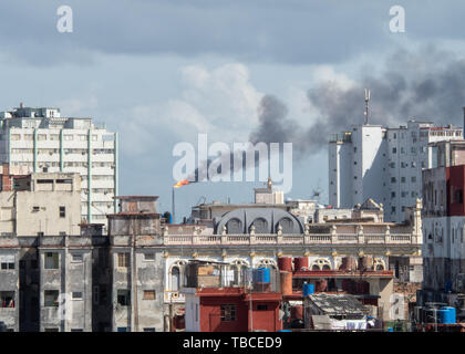 Oil refinery tower and smoke pollution in Old Havana, Cuba Stock Photo