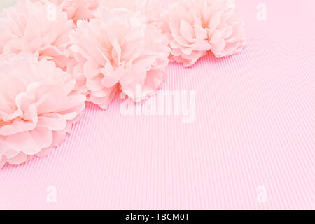 Delicate pink background mock up with paper peonies and place for text Stock Photo