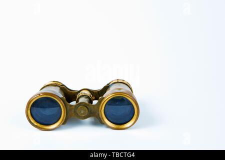 Vintage classical brass binoculars on white background, front view Stock Photo