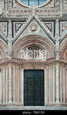 Siena Cathedral door closeup as the famous landmark in medieval town in Italy. Stock Photo