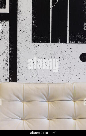Detail of white leather sofa in dressing room. Gebr de Nobel, Leiden, Netherlands. Architect: Ector Hoogstad Architecten, 2014. Stock Photo