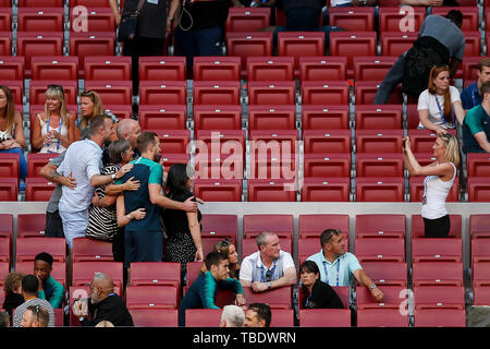 Madrid, Spain. 31st May, 2019. Harry Kane of Tottenham Hotspur poses for a photo with his fiancee Katie Goodland and family after a training session prior to the UEFA Champions League Final match between Liverpool and Tottenham Hotspur at Wanda Metropolitano on May 31st 2019 in Madrid, Spain. (Photo by Daniel Chesterton/phcimages.com) Credit: PHC Images/Alamy Live News Stock Photo