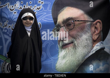May 31, 2019 - Tehran, Tehran, Iran - Iranians attend a parade marking al-Quds (Jerusalem) International Day in Tehran. An initiative started by Iranian revolutionary leader Ayatollah Ruhollah Khomeini, Quds Day is held annually on the last Friday of the Muslim fasting month of Ramadan and calls for Jerusalem to be returned to the Palestinians. (Credit Image: © Rouzbeh Fouladi/ZUMA Wire) Stock Photo
