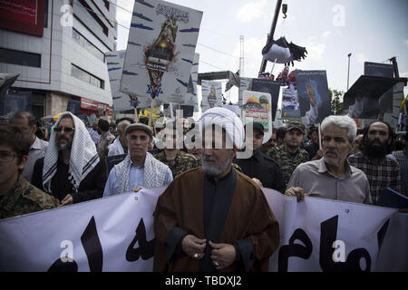 May 31, 2019 - Tehran, Tehran, Iran - Iranians attend a parade marking al-Quds (Jerusalem) International Day in Tehran. An initiative started by Iranian revolutionary leader Ayatollah Ruhollah Khomeini, Quds Day is held annually on the last Friday of the Muslim fasting month of Ramadan and calls for Jerusalem to be returned to the Palestinians. (Credit Image: © Rouzbeh Fouladi/ZUMA Wire) Stock Photo