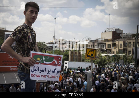 May 31, 2019 - Tehran, Tehran, Iran - Iranians attend a parade marking al-Quds (Jerusalem) International Day in Tehran. An initiative started by Iranian revolutionary leader Ayatollah Ruhollah Khomeini, Quds Day is held annually on the last Friday of the Muslim fasting month of Ramadan and calls for Jerusalem to be returned to the Palestinians. (Credit Image: © Rouzbeh Fouladi/ZUMA Wire) Stock Photo