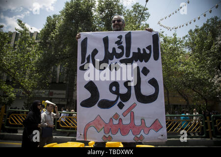 May 31, 2019 - Tehran, Tehran, Iran - Iranians attend a parade marking al-Quds (Jerusalem) International Day in Tehran. An initiative started by Iranian revolutionary leader Ayatollah Ruhollah Khomeini, Quds Day is held annually on the last Friday of the Muslim fasting month of Ramadan and calls for Jerusalem to be returned to the Palestinians. (Credit Image: © Rouzbeh Fouladi/ZUMA Wire) Stock Photo