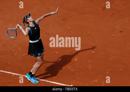 Paris, Paris. 31st May, 2019. Garbine Muguruza of Spain serves during the women's singles third round match with Elina Svitolina of Ukraine at French Open tennis tournament 2019 at Roland Garros, in Paris, France on May 31, 2019. Credit: Han Yan/Xinhua/Alamy Live News Stock Photo