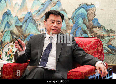 Berlin, Germany. 28th May, 2019. Chinese Ambassador to Germany Wu Ken speaks in an interview with Xinhua in Berlin, Germany, May 28, 2019. The relations between China and Germany are beyond bilateral ties and their cooperation has achieved 'a whole greater than the sum of the parts,' Chinese Ambassador to Germany Wu Ken has said. Credit: Shan Yuqi/Xinhua/Alamy Live News Stock Photo