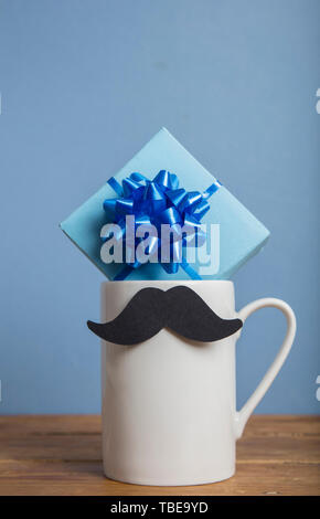 Father's day present with a coffee mug and paper mustache Stock Photo