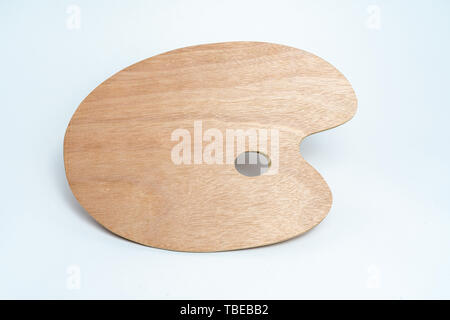 Wooden brown painter's palette isolated on white background Stock Photo