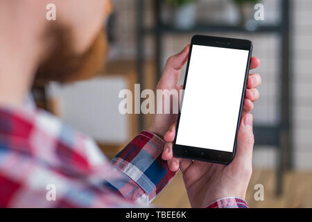 Mockup image - man holding black smartphone with white blank screen Stock Photo