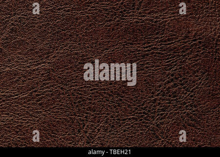 Dark brown leather texture background, closeup. Bronze cracked backdrop from wrinkle skin, structure of textile. Stock Photo