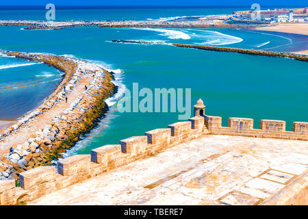 The Medieval Bastion Of Kasbah Of The Udayas With Two Small Turrets And The Breakwaters That Separate The Bou Regreg River Mouth From The Atlantic Oce Stock Photo Alamy