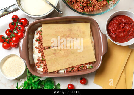 Uncooked lasagna in light table Stock Photo