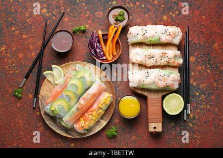 Tasty spring rolls on color table Stock Photo