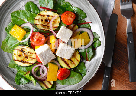 Healthy salad with feta cheese on plate Stock Photo