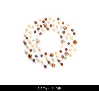 Frame made of tasty hazelnuts on white background Stock Photo