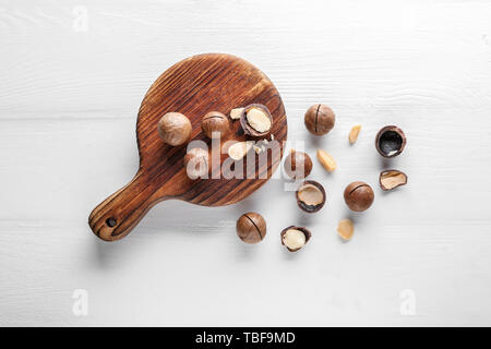 Tasty macadamia nuts on white table Stock Photo