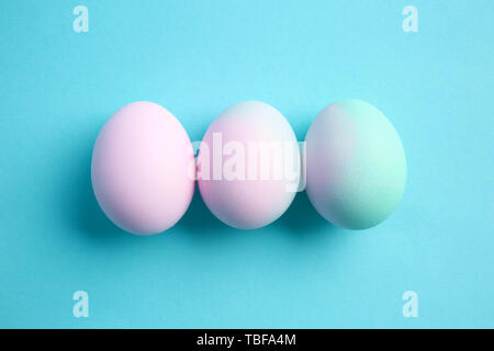 Beautiful Easter eggs on color background Stock Photo