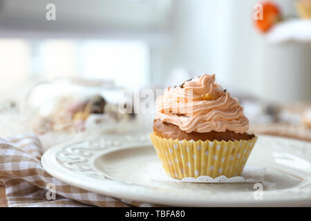 Tasty Easter cupcake on plate Stock Photo