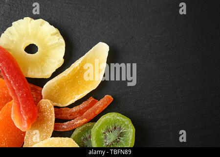 Tasty dried fruits on dark background Stock Photo