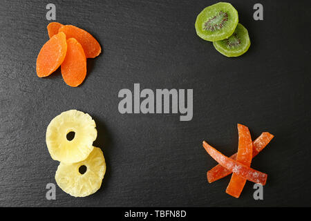 Tasty dried fruits on dark background Stock Photo