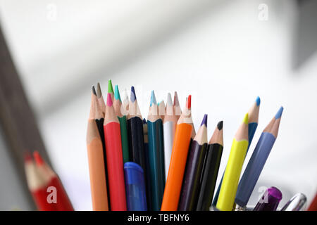 Bunch of various pencils stand in holder Stock Photo