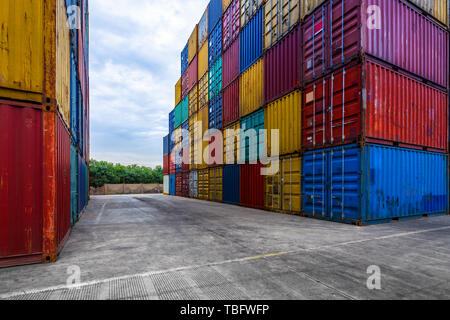 stack of containers with empty road in front Stock Photo